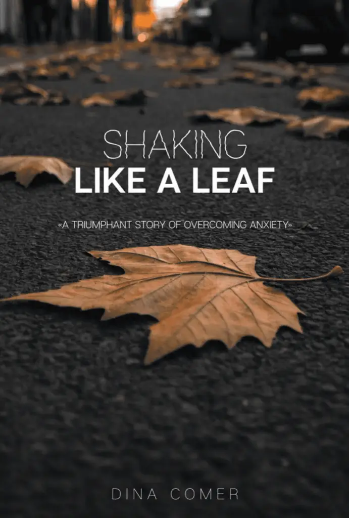 A dry leaf lying on a textured surface, symbolizing fragility and change.