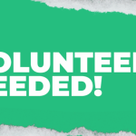 Words spell "Volunteers needed" in white over a teal background that looks like a torn piece of paper.