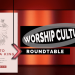 Book in the background featuring a lion and worship culture roundtable.